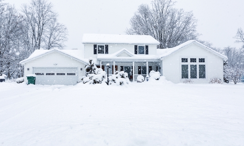 White home covered in snow