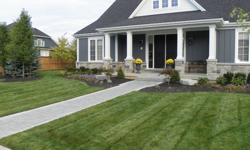 Model home with manicured front yard